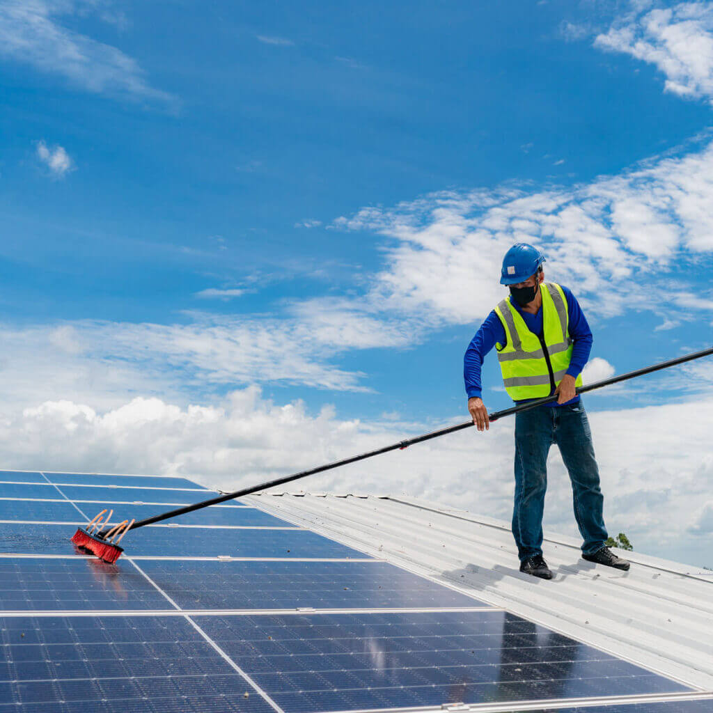 Solar roof cleaning, Professional technicians were washing and the surface of the solar panels Solar Panel Washing
